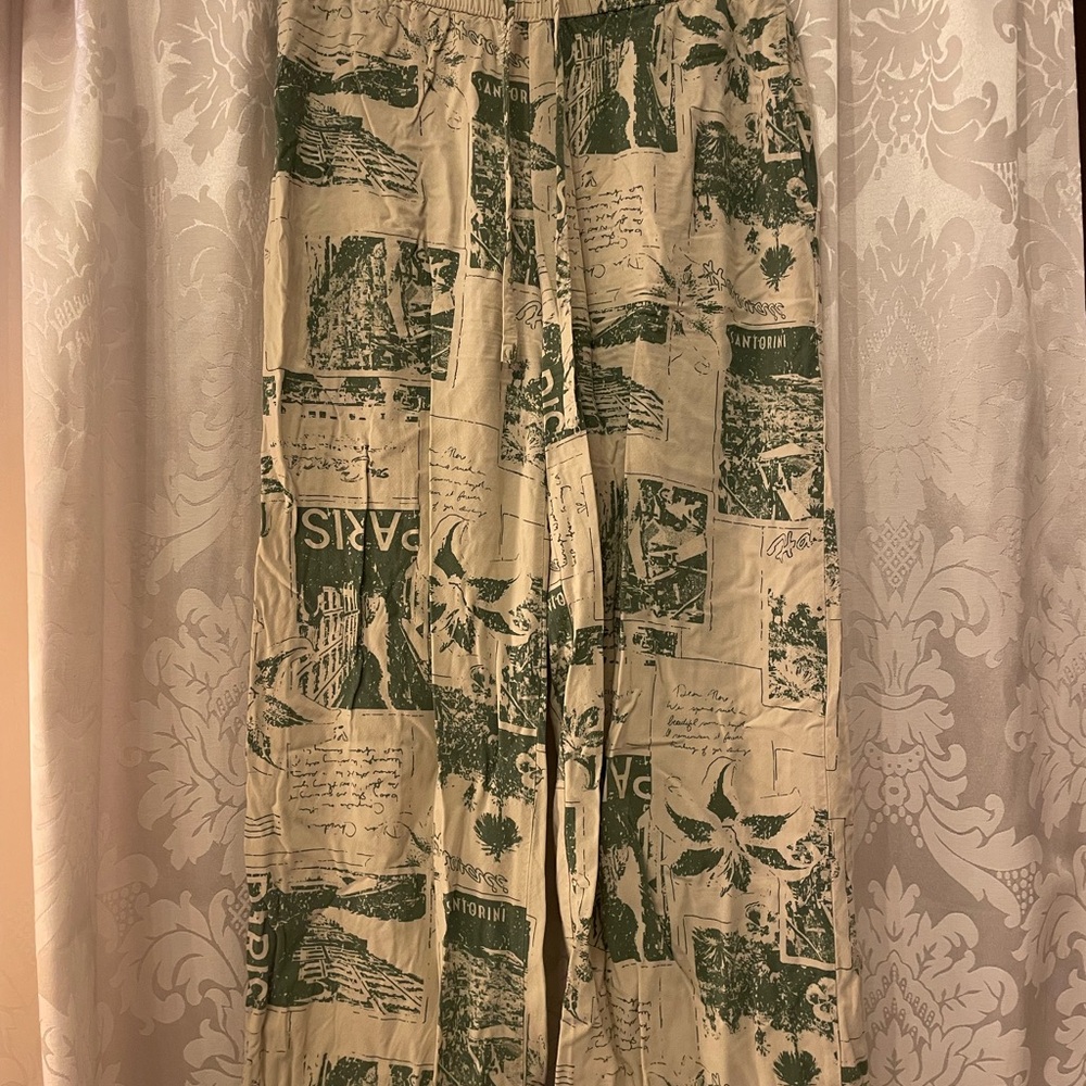 Vintage-Style Newspaper Tourist Print Green and Beige Flowy Pants